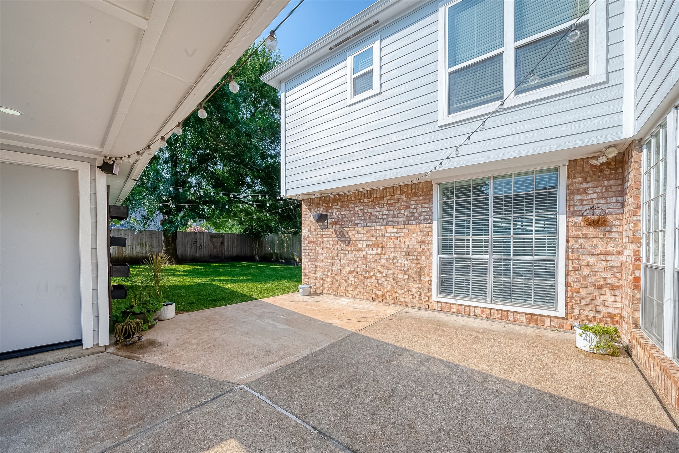 8910 Bonnyview Drive Houston, TX 77095 - Photo 27 of 31 a front view of a house with a yard and garage