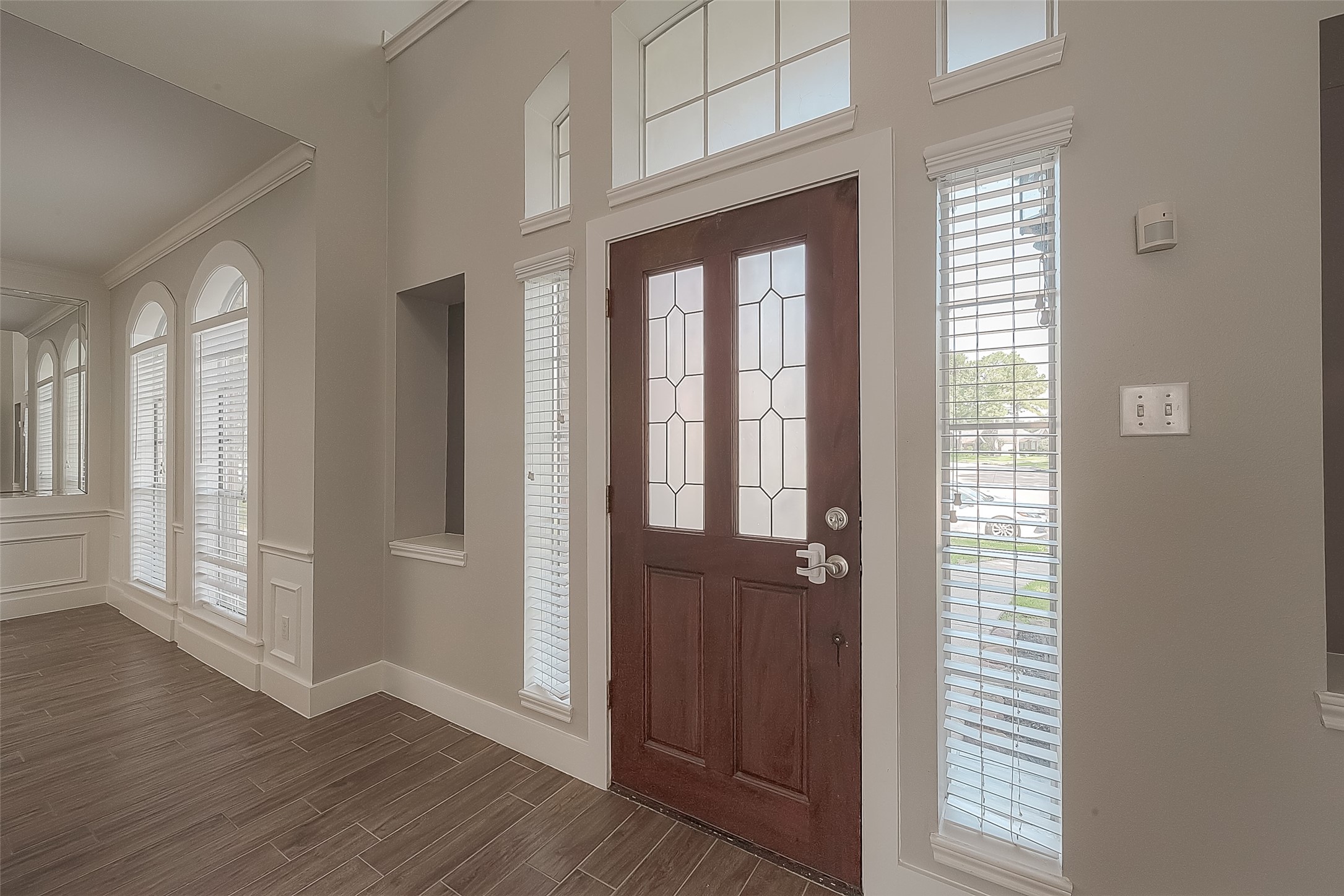 8910 Bonnyview Drive Houston, TX 77095 - Photo 3 of 31 a view of an entryway with wooden floor