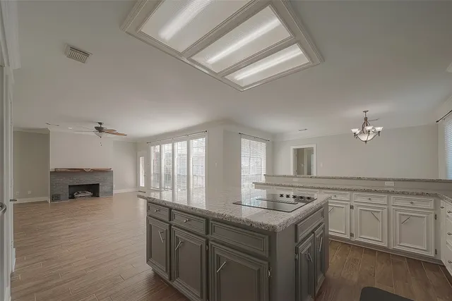 a kitchen with a stove cabinets and a sink