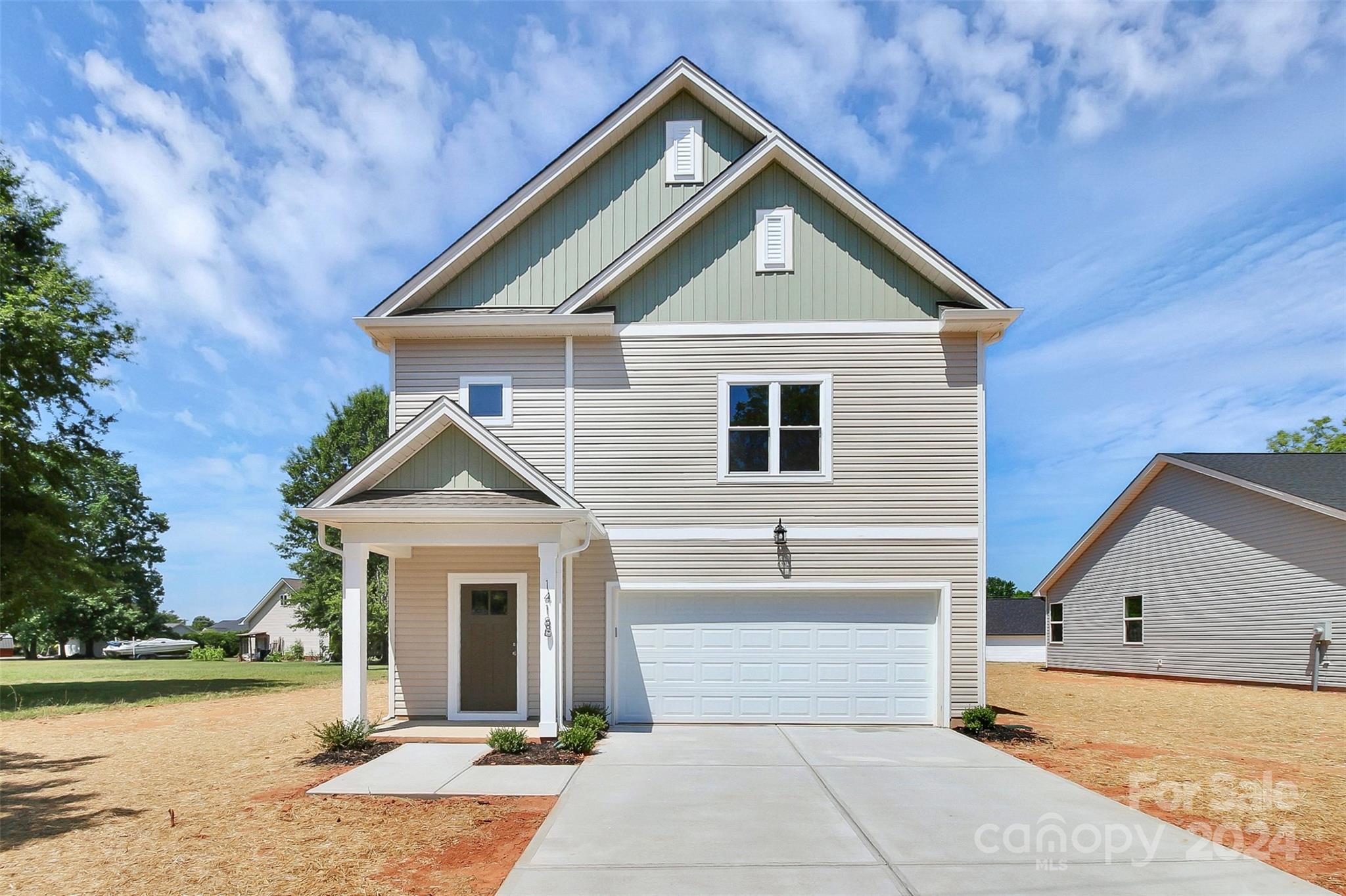 1418 Azalea Avenue Kannapolis, NC 28081 - Photo 2 of 39 a front view of a house with a yard and garage