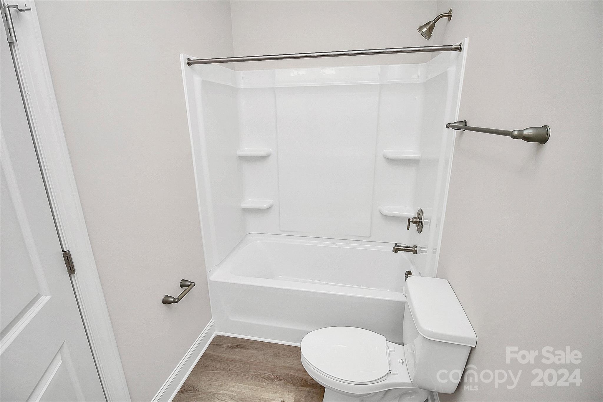 1418 Azalea Avenue Kannapolis, NC 28081 - Photo 21 of 39 a bathroom with a toilet and a bathtub