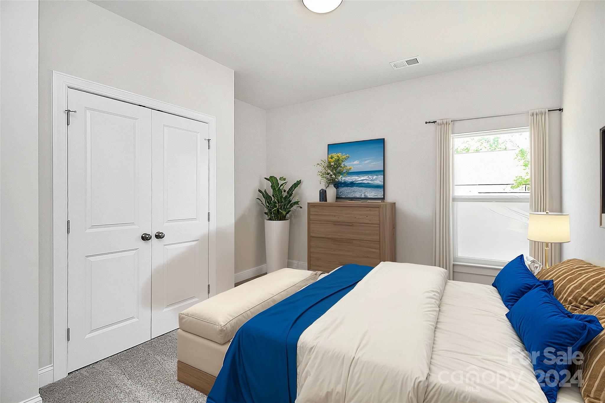 1418 Azalea Avenue Kannapolis, NC 28081 - Photo 22 of 39 a bedroom with a bed and a potted plant