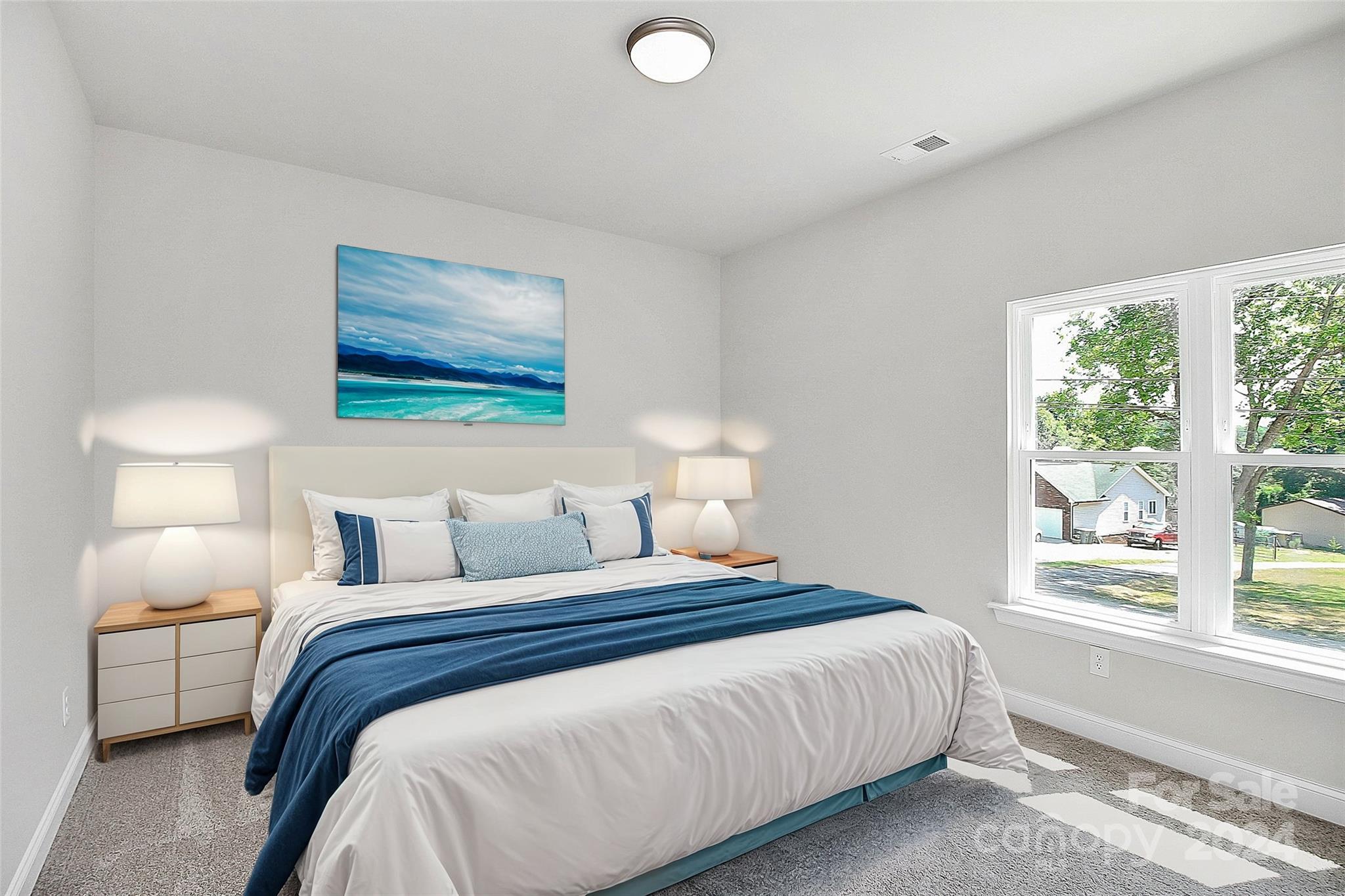1418 Azalea Avenue Kannapolis, NC 28081 - Photo 24 of 39 a bedroom with a bed and a painting on the wall