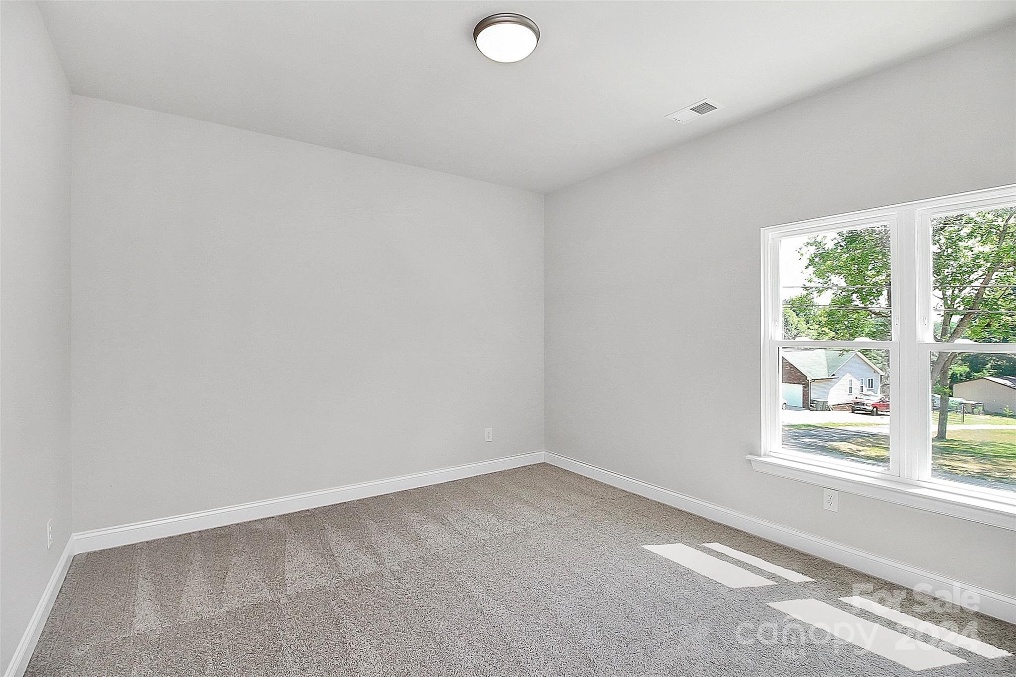 1418 Azalea Avenue Kannapolis, NC 28081 - Photo 25 of 39 an empty room with a window