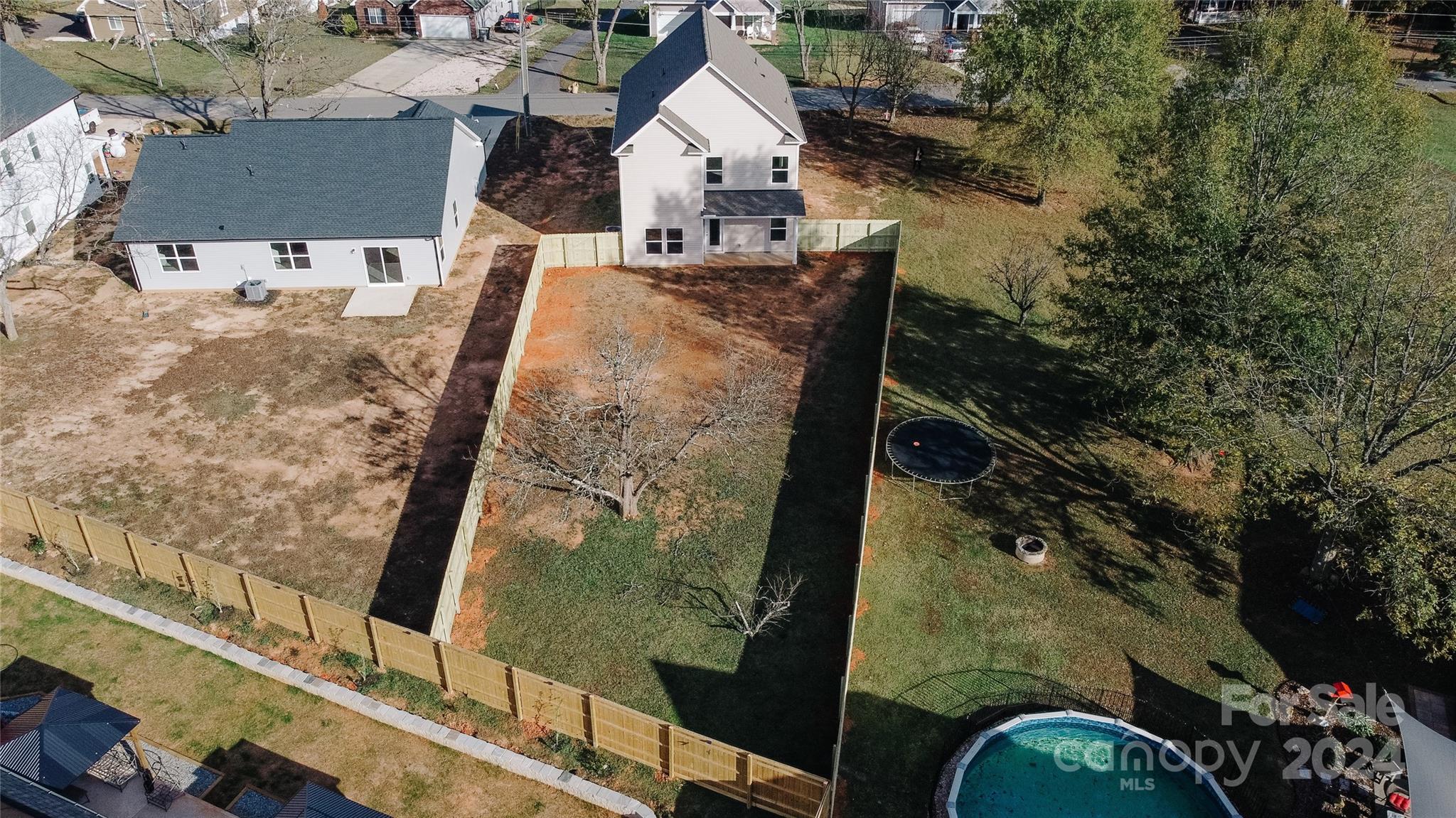 1418 Azalea Avenue Kannapolis, NC 28081 - Photo 38 of 39 an aerial view of a house with large trees