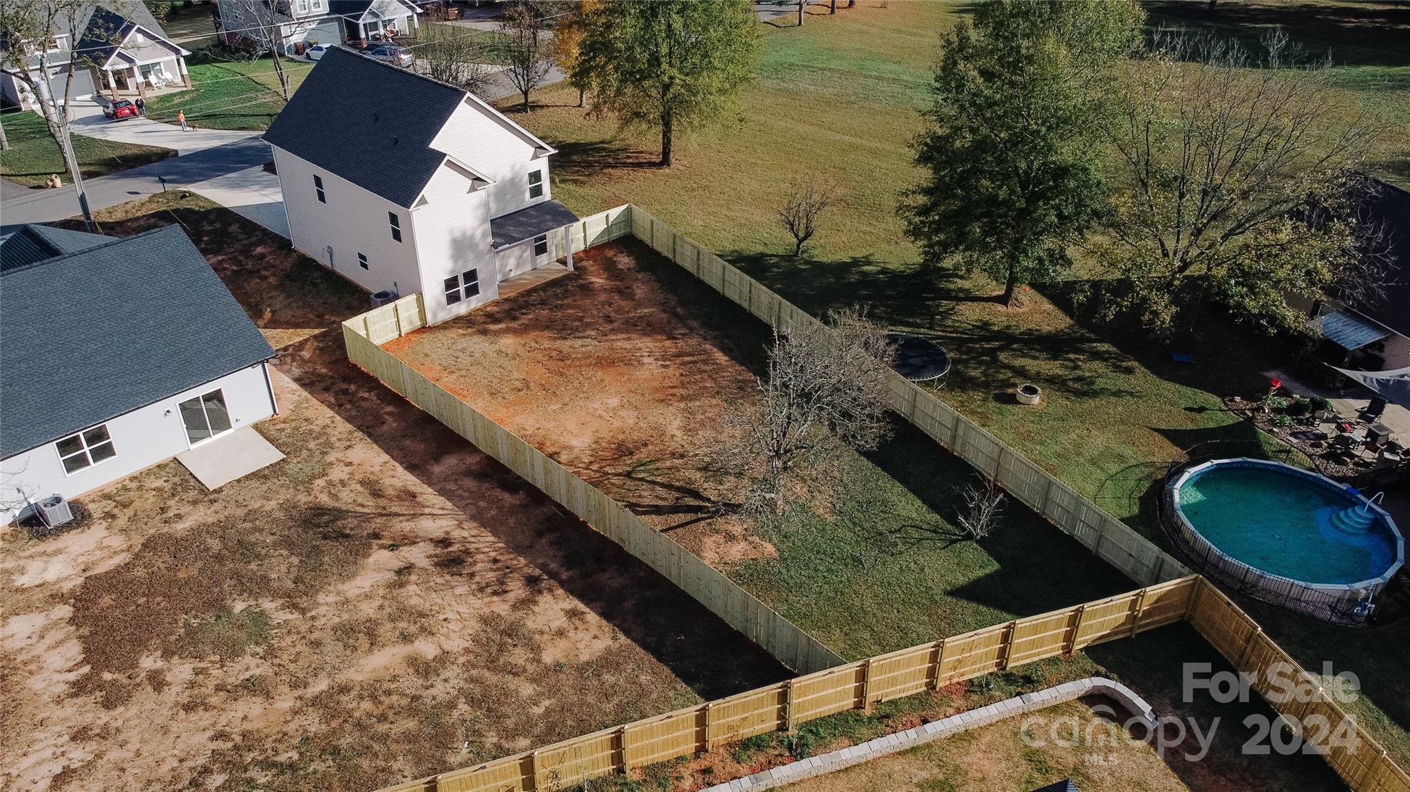1418 Azalea Avenue Kannapolis, NC 28081 - Photo 39 of 39 an aerial view of a house with a lake view