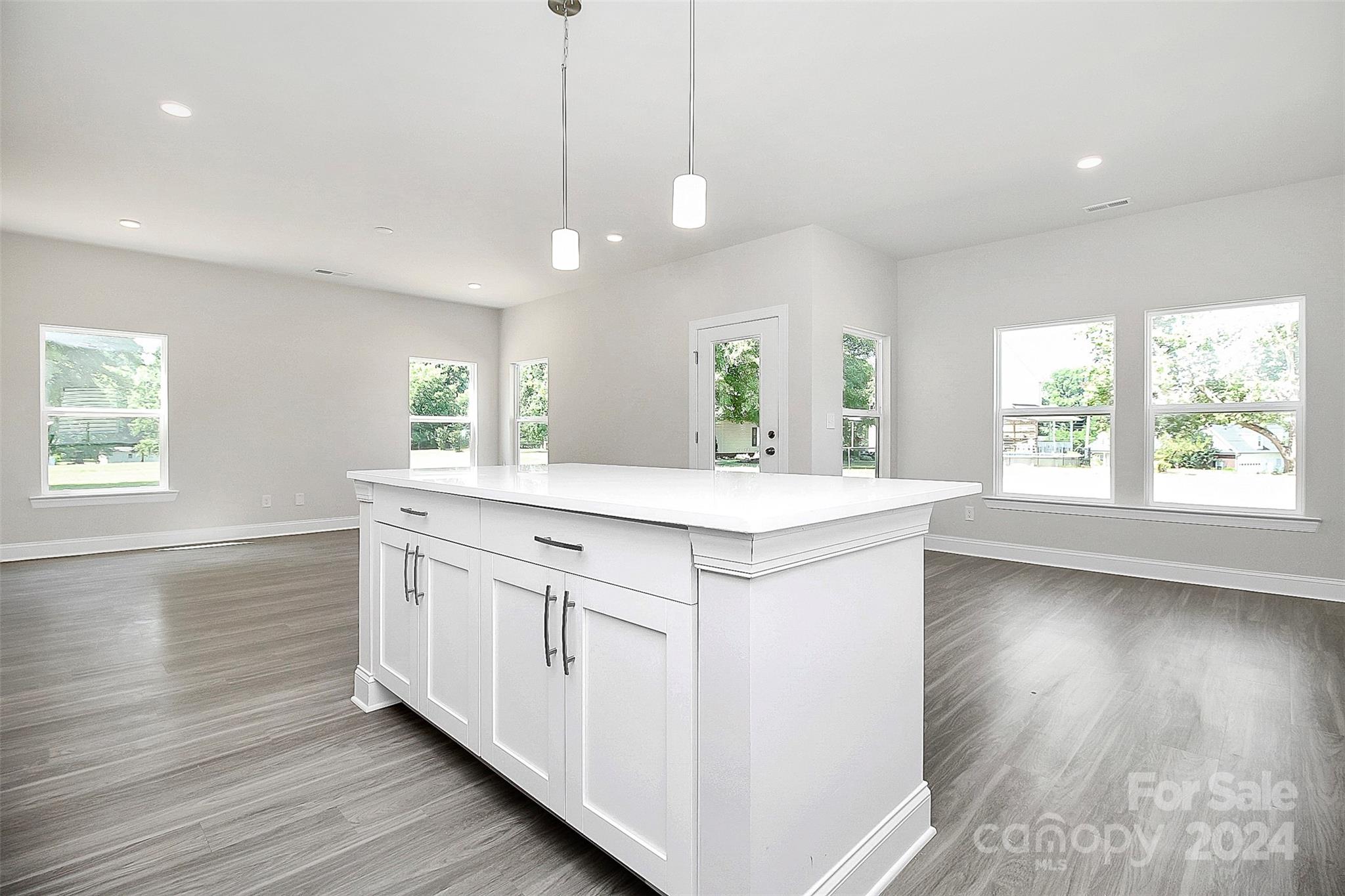 1418 Azalea Avenue Kannapolis, NC 28081 - Photo 10 of 39 a kitchen with a sink window and wooden floor