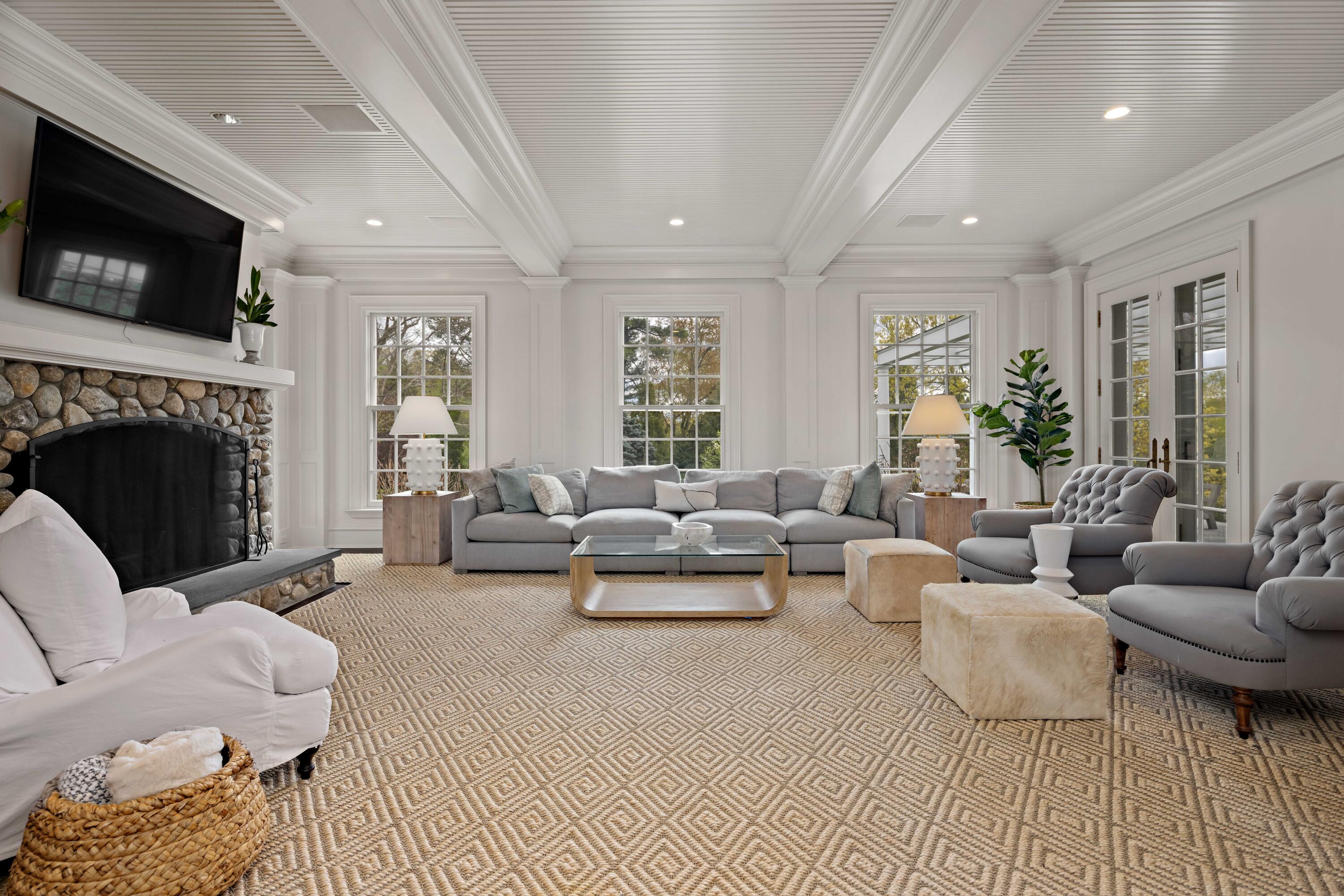 625 Oenoke Ridge New Canaan, CT 06840 - Photo 17 of 40 a living room with furniture fireplace and flat screen tv
