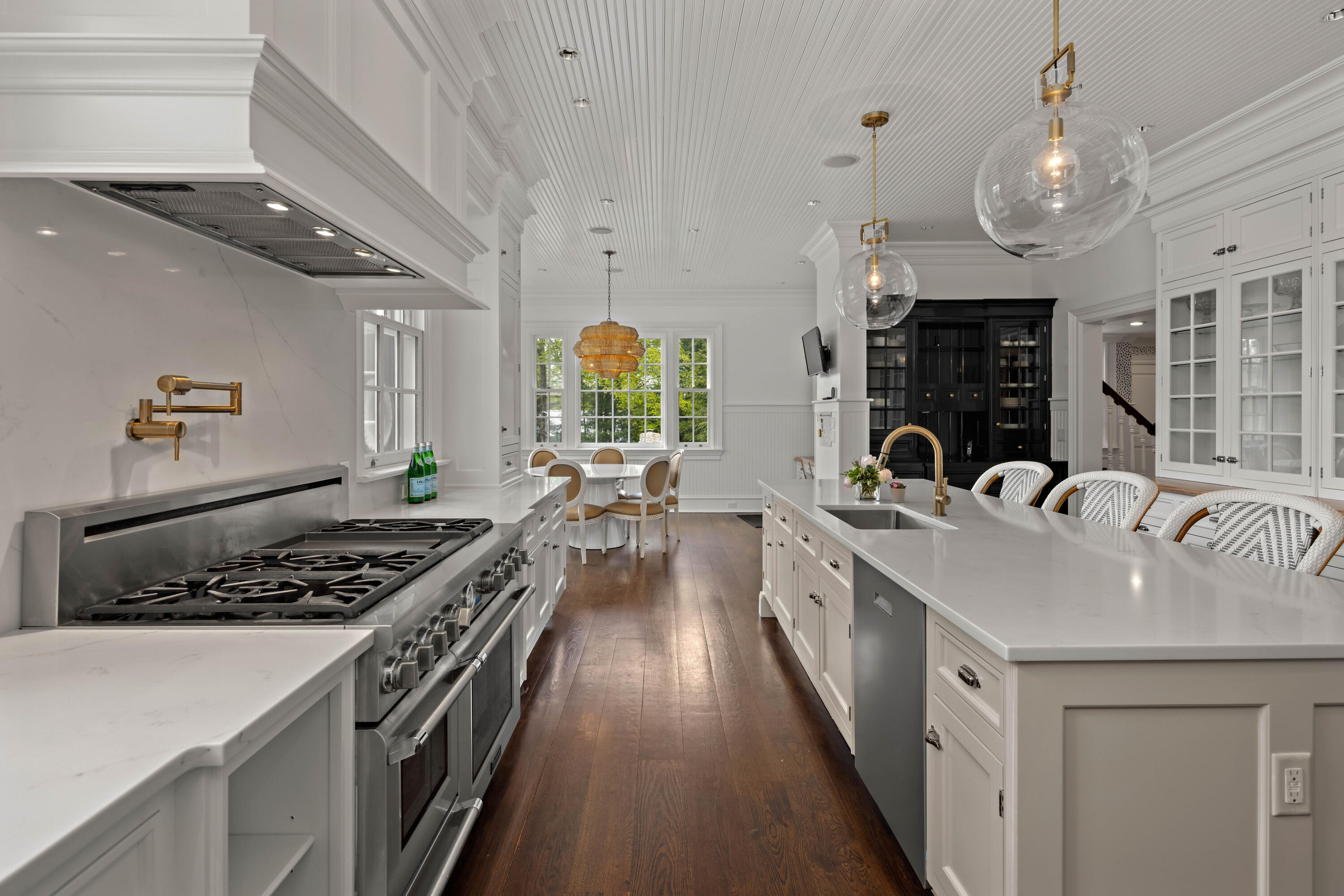 625 Oenoke Ridge New Canaan, CT 06840 - Photo 19 of 40 a kitchen with stainless steel appliances granite countertop a sink stove and cabinets