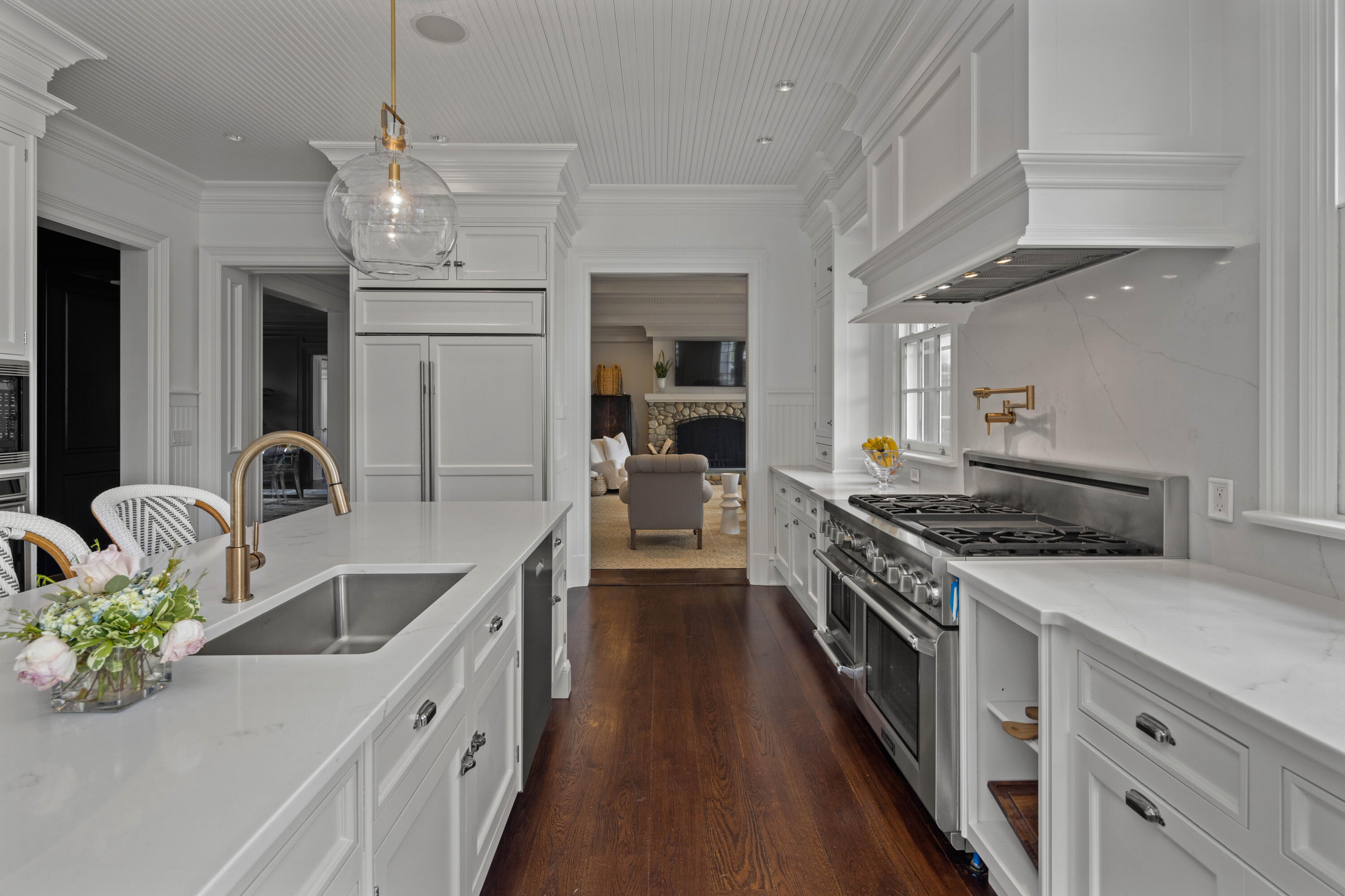 625 Oenoke Ridge New Canaan, CT 06840 - Photo 20 of 40 a kitchen with stainless steel appliances granite countertop a sink stove and refrigerator