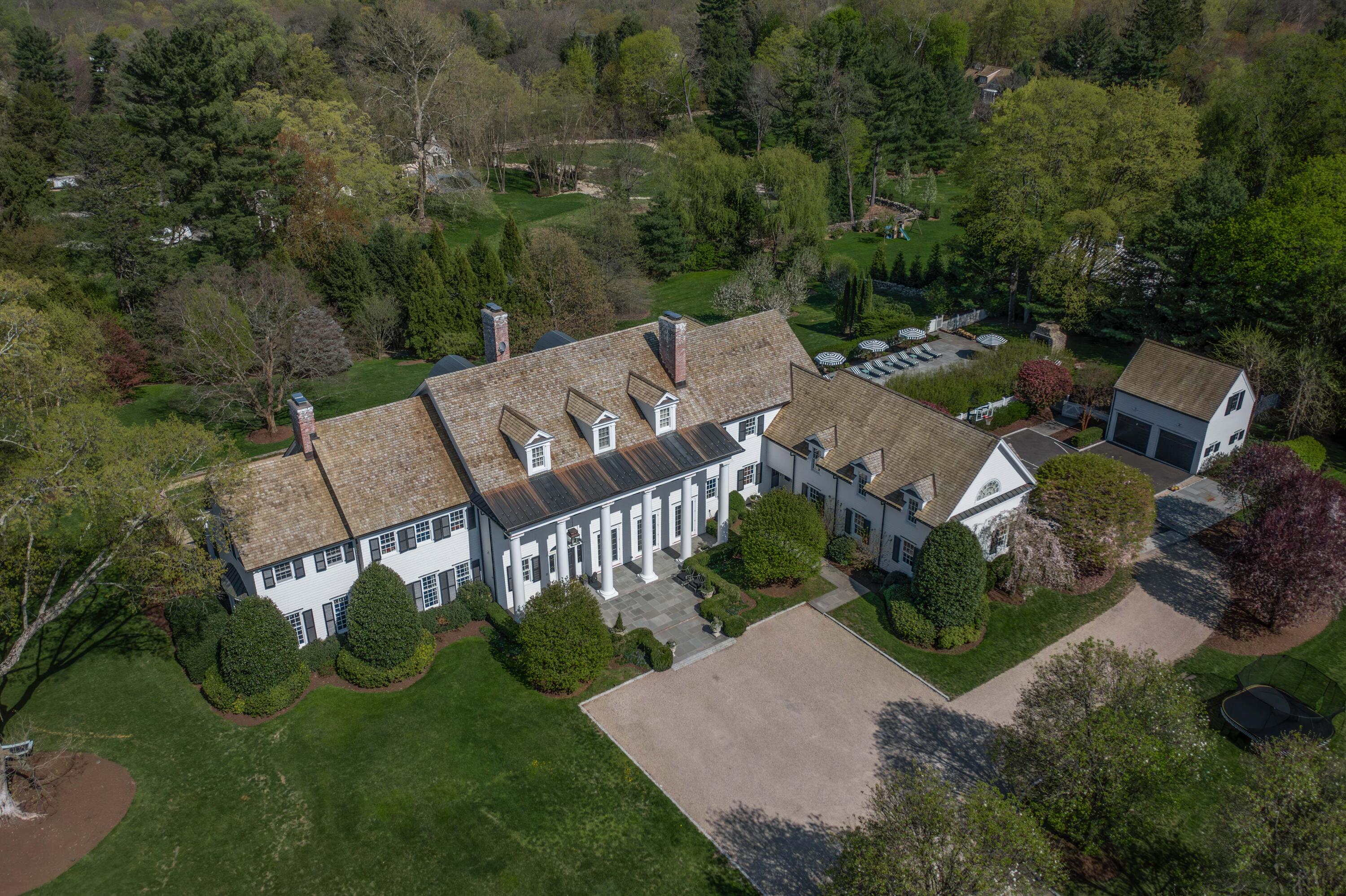625 Oenoke Ridge New Canaan, CT 06840 - Photo 2 of 40 an aerial view of multiple houses with a yard
