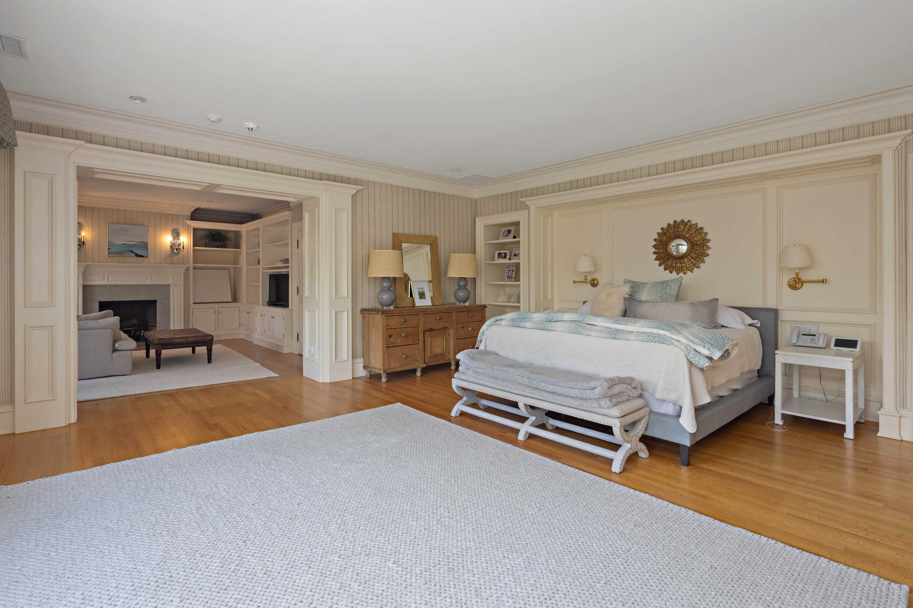 625 Oenoke Ridge New Canaan, CT 06840 - Photo 24 of 40 a bedroom with a bed and wooden floor