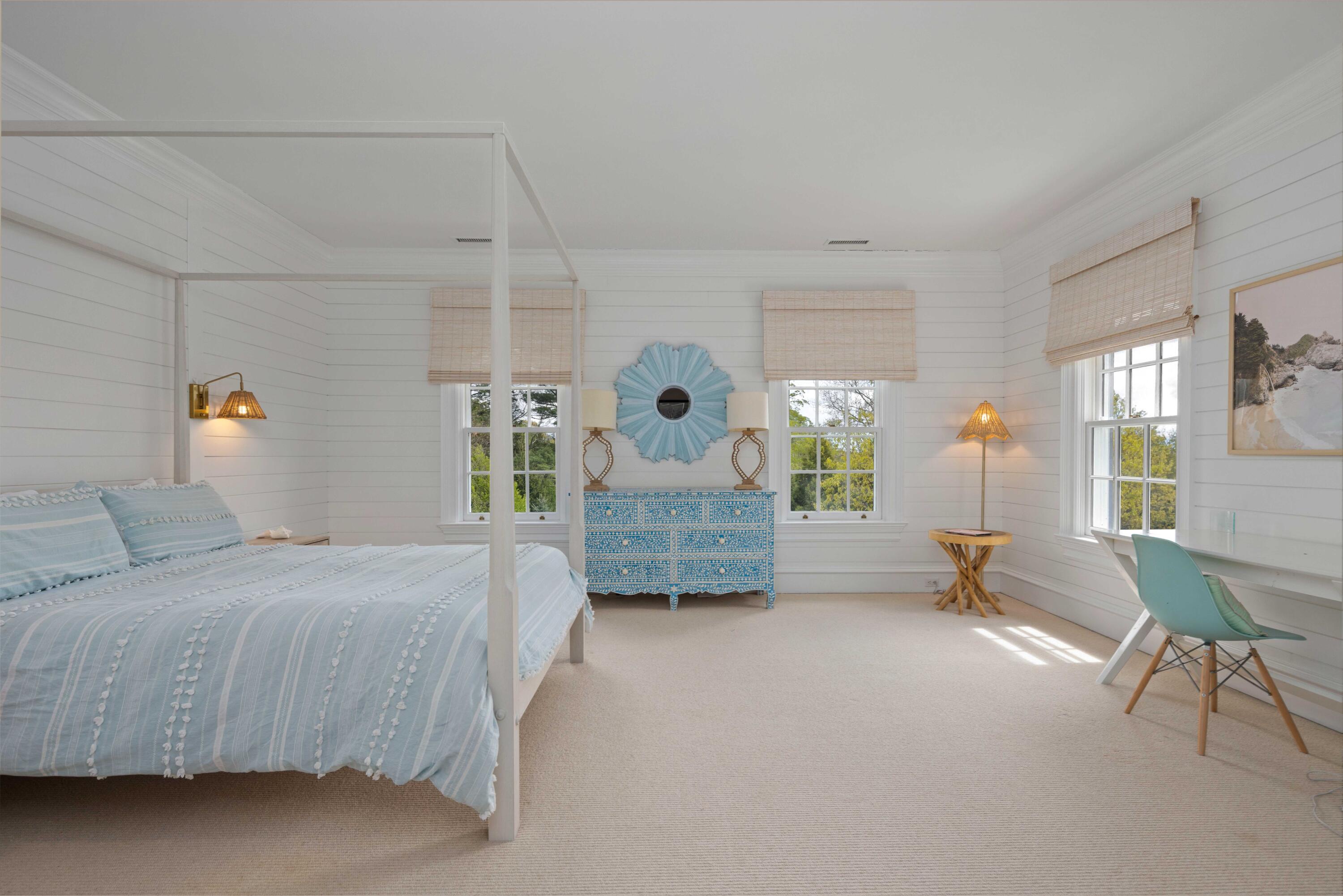 625 Oenoke Ridge New Canaan, CT 06840 - Photo 27 of 40 a bedroom with a bed mirror and window