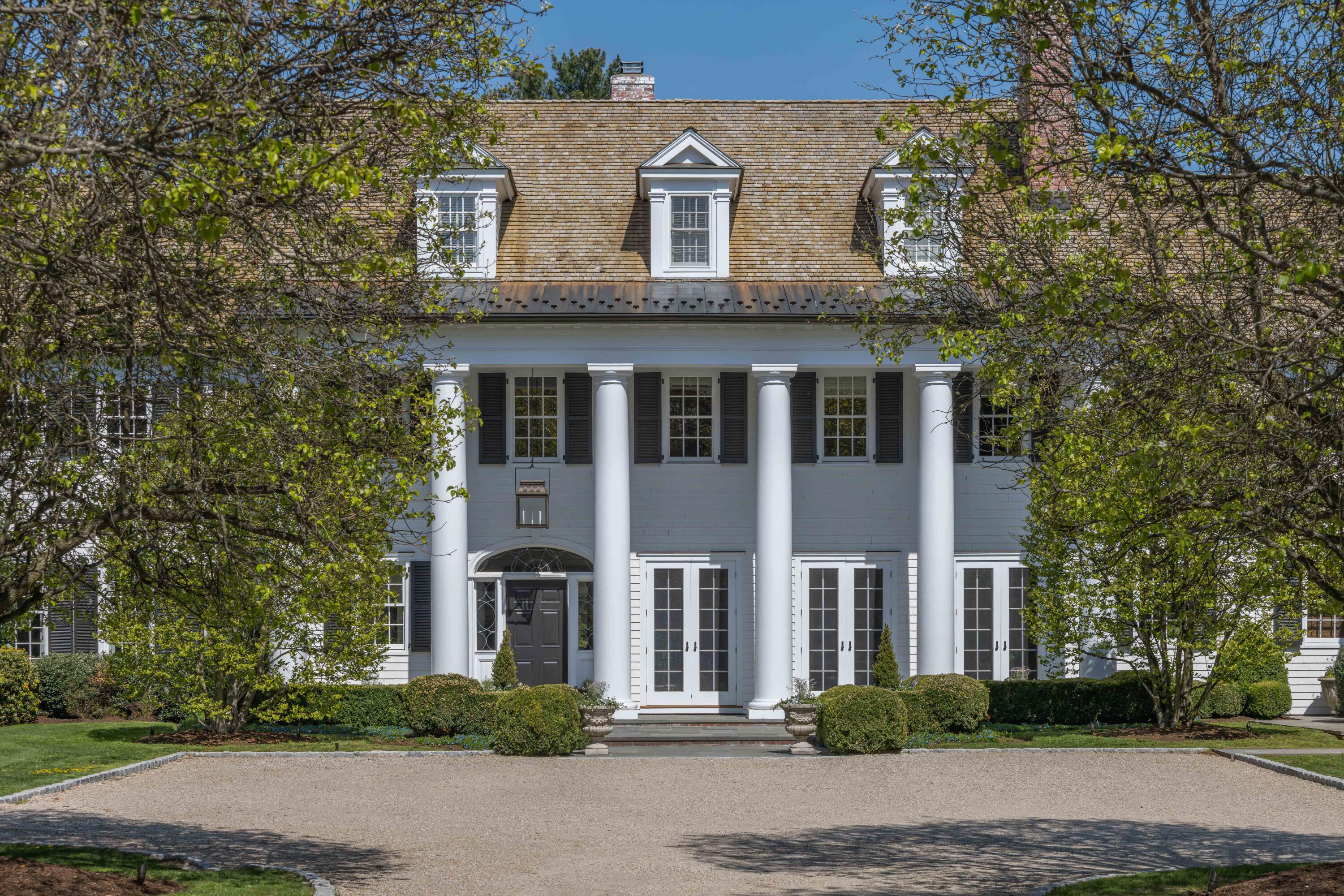625 Oenoke Ridge New Canaan, CT 06840 - Photo 3 of 40 a front view of a house with a yard