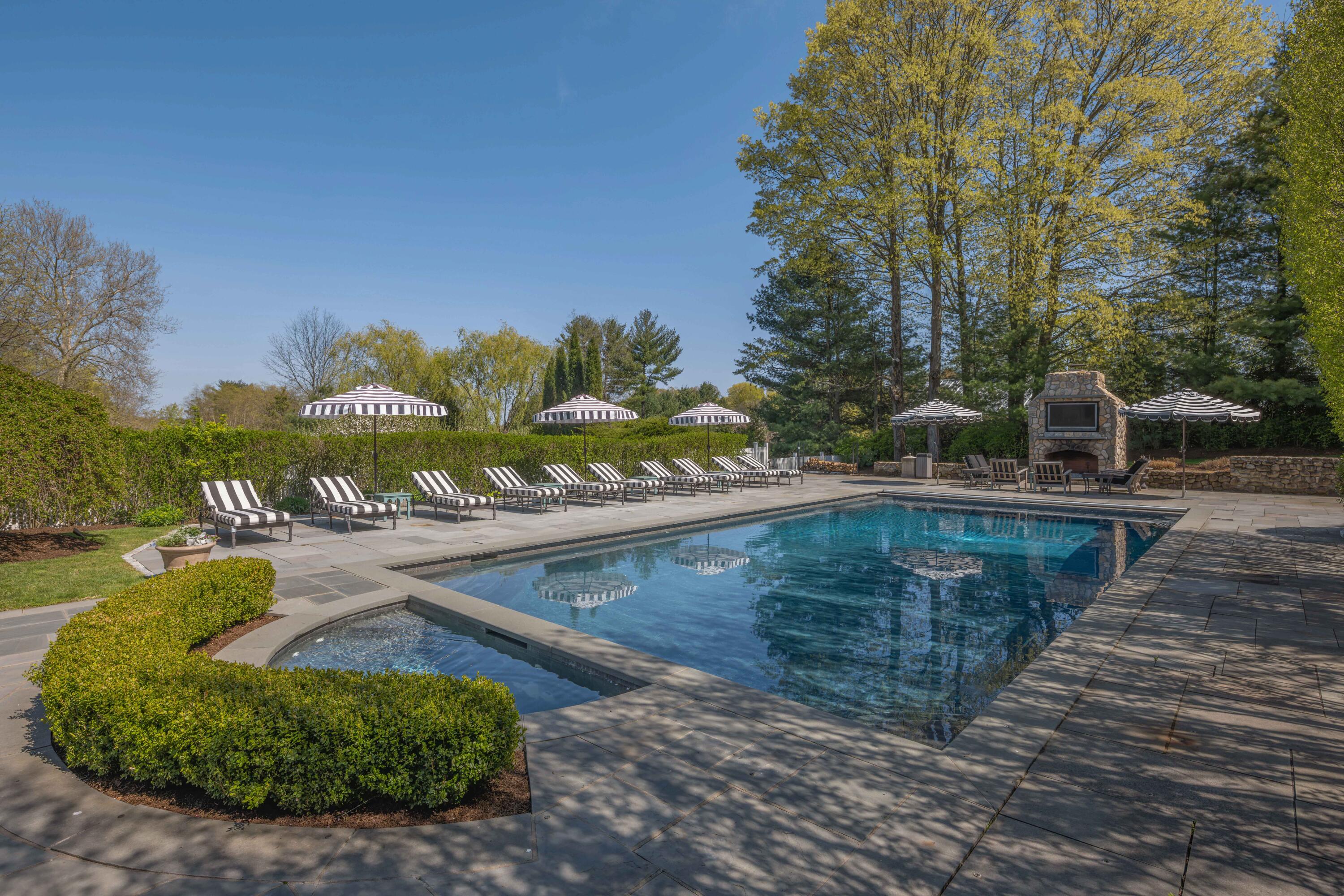 625 Oenoke Ridge New Canaan, CT 06840 - Photo 36 of 40 a view of a swimming pool with a yard