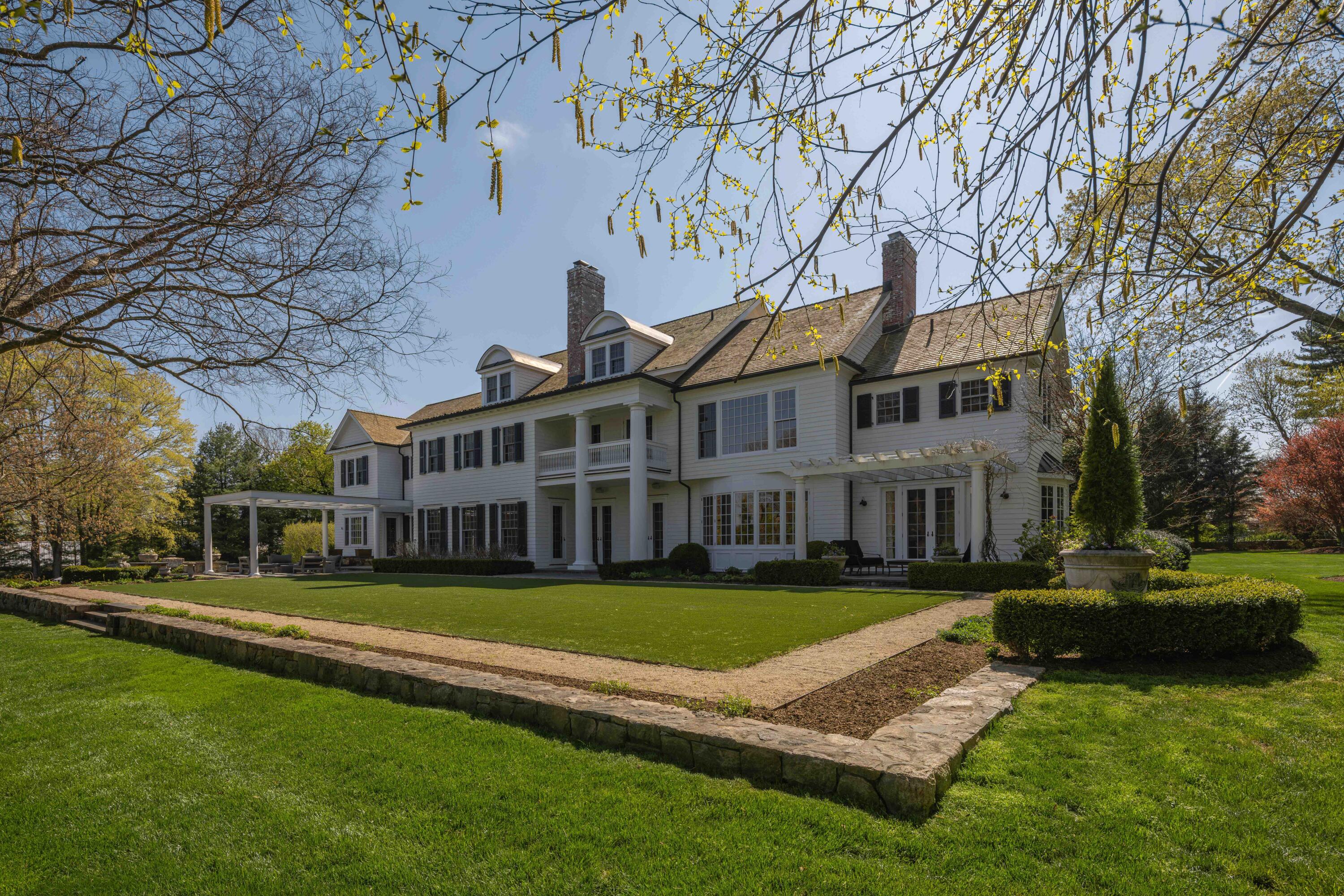 625 Oenoke Ridge New Canaan, CT 06840 - Photo 39 of 40 a view of a house with a yard in a patio