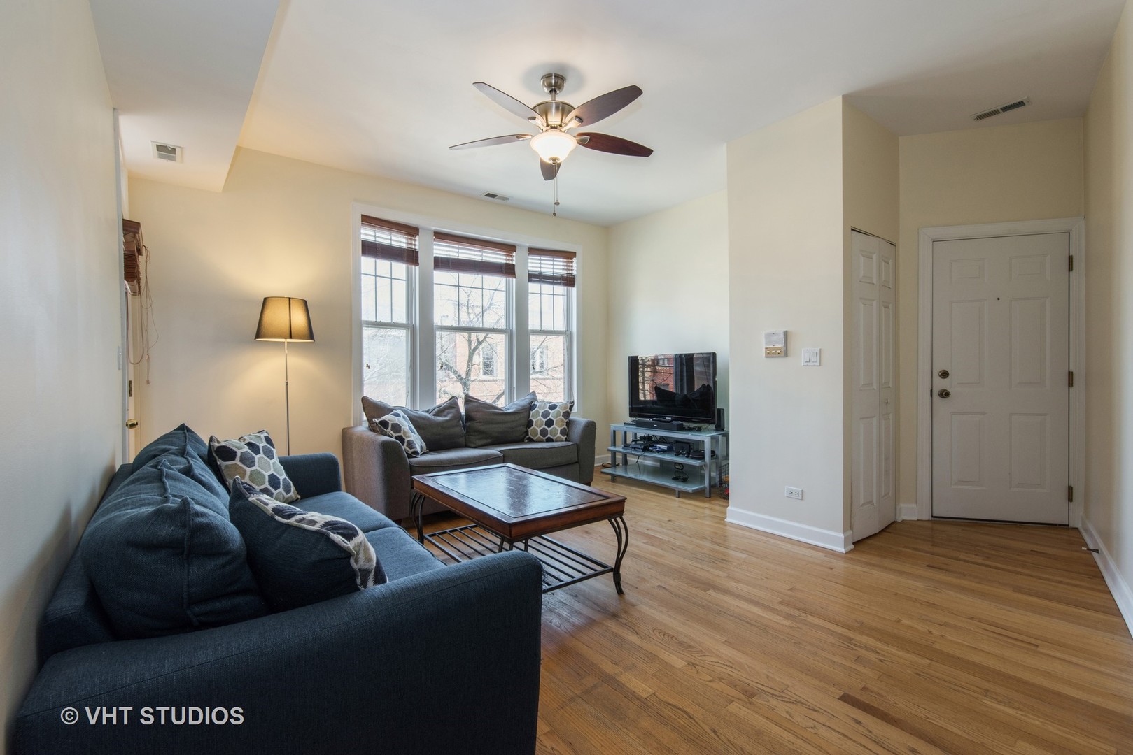 2010 North Spaulding Avenue, Unit 2 Chicago, IL 60647 - Photo 2 of 10 a living room with furniture and a window