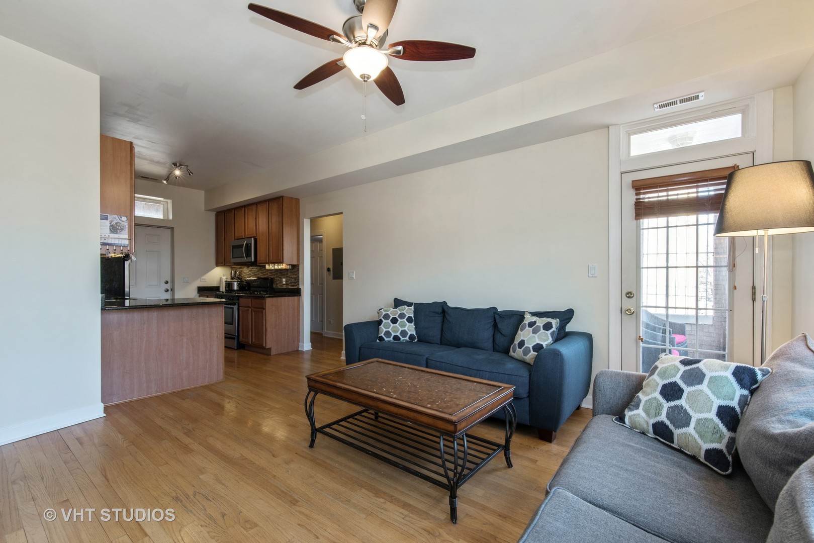 2010 North Spaulding Avenue, Unit 2 Chicago, IL 60647 - Photo 3 of 10 a living room with furniture and a kitchen view