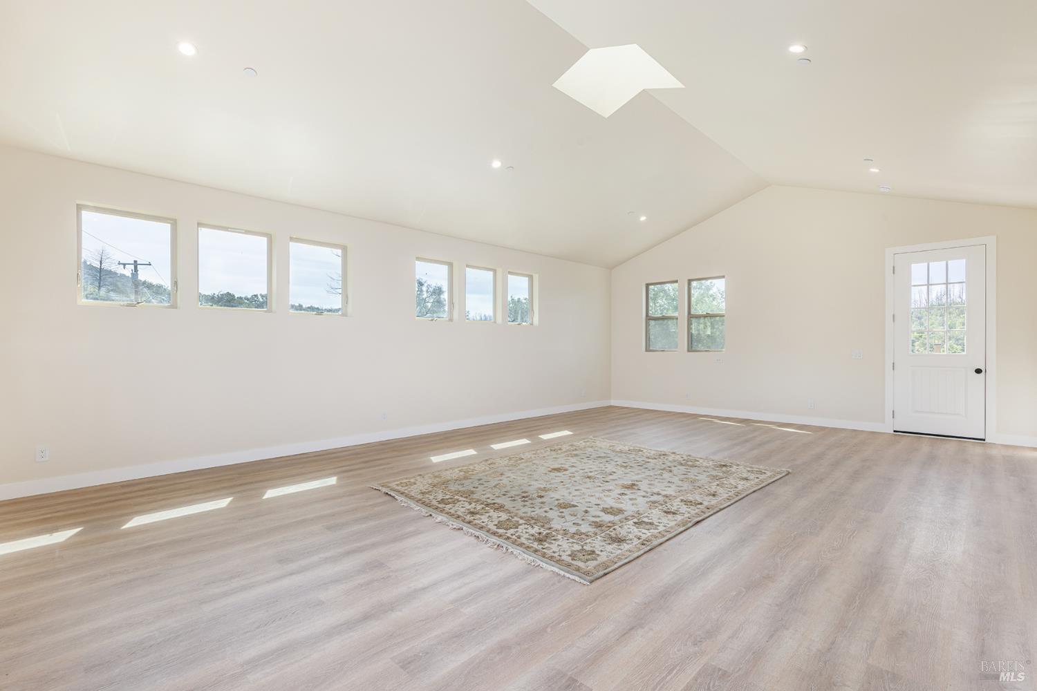 753 Sunnyside Road St. Helena, CA 94574 - Photo 36 of 55 an empty room with wooden floor and window