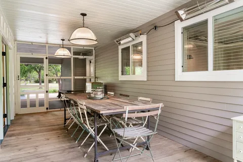 a view of an outside dining space with furniture window