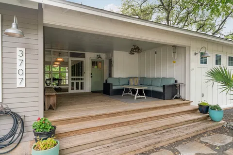 a view of a house with sitting area and furniture