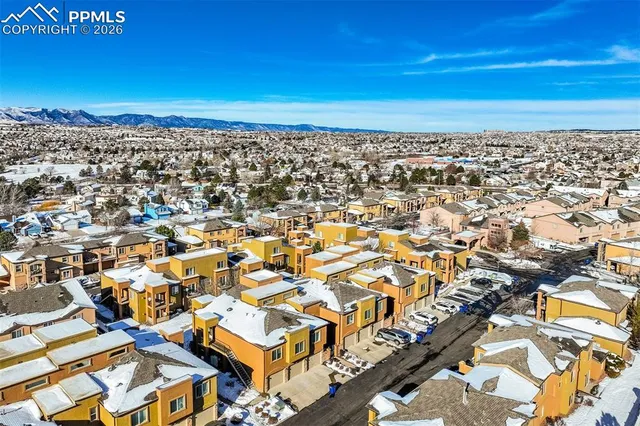 an aerial view of residential building with parking space
