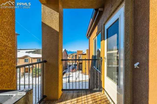 a view of a balcony with a potted plant