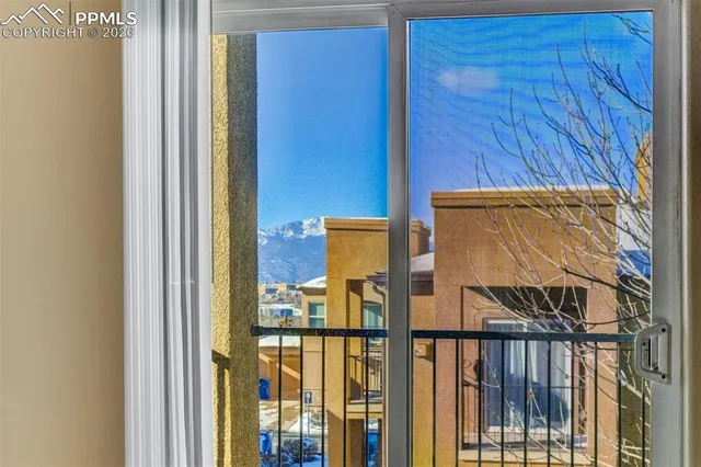 a view of a door and wooden floor