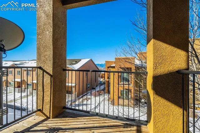 a view of a balcony with wooden floor