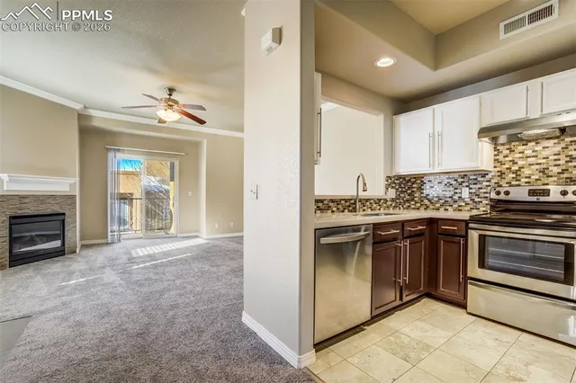 a stove top oven sitting inside of a kitchen