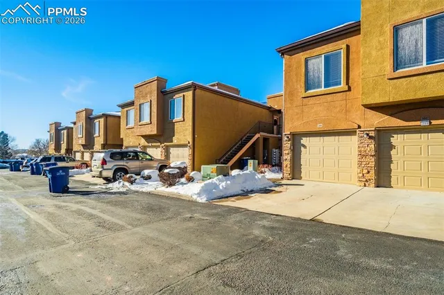 a view of a house with outdoor seating