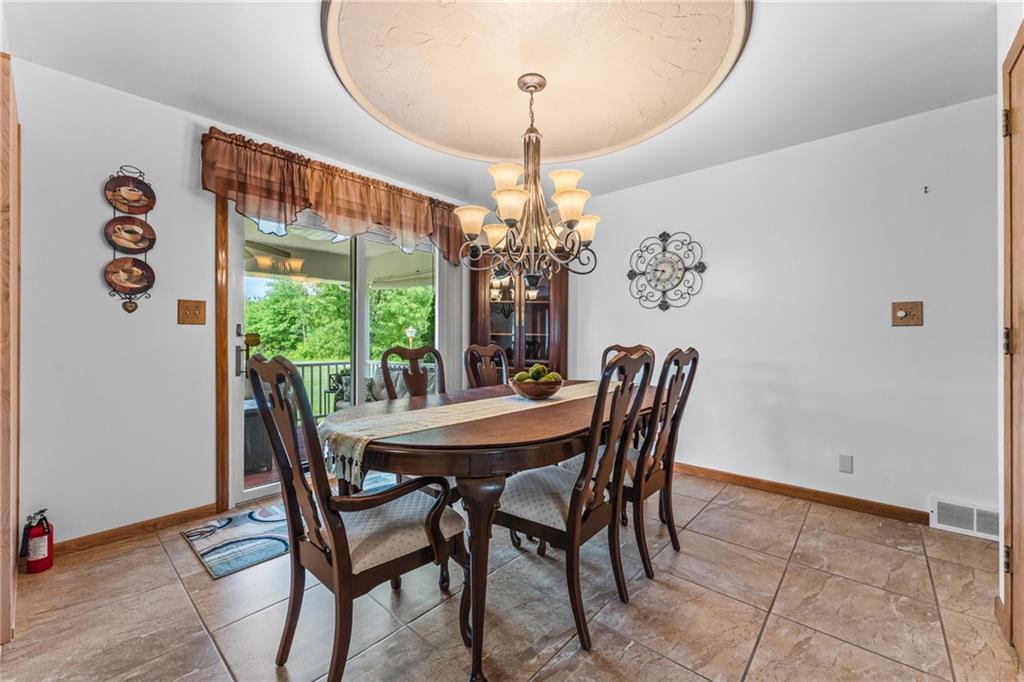 3933 Mitchell Road New Castle, PA 16105 - Photo 5 of 6 a dining room with furniture a chandelier and window