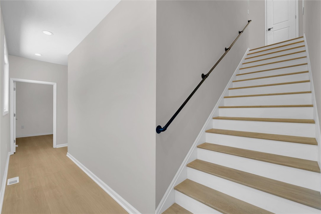 159 Cherokee Trail Easley, SC 29640 - Photo 5 of 38 Clean lines and a striking staircase define this contemporary entryway.