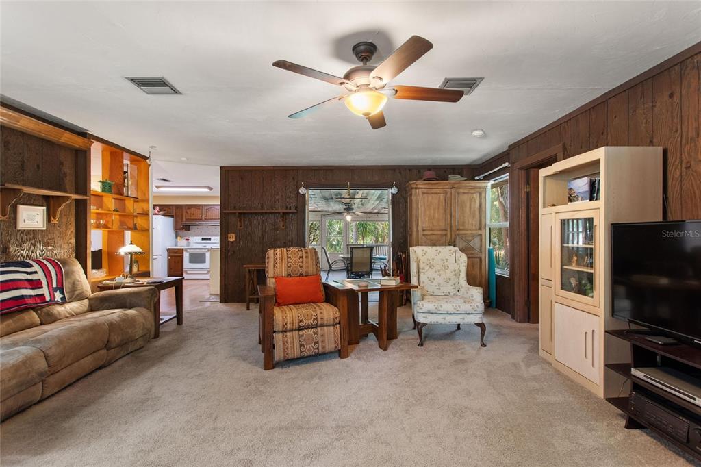 3641 Turtle Mound Road Melbourne, FL 32934 - Photo 22 of 77 a living room with furniture fireplace and flat screen tv