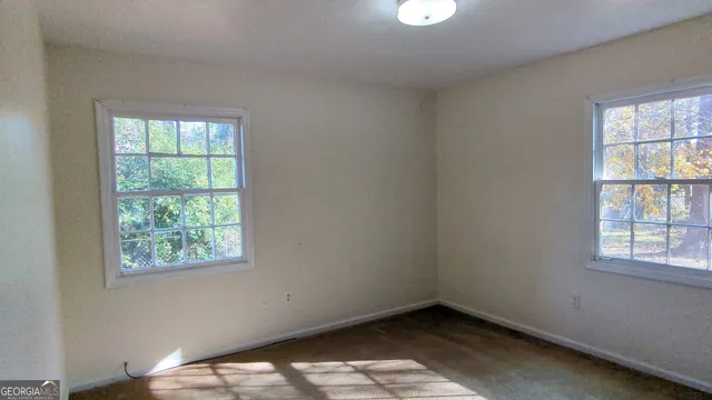 an empty room with windows