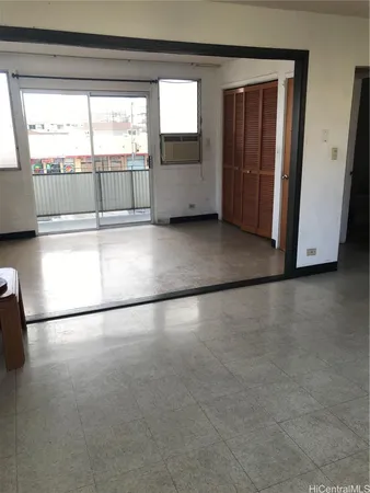 a view of a living room with a large window