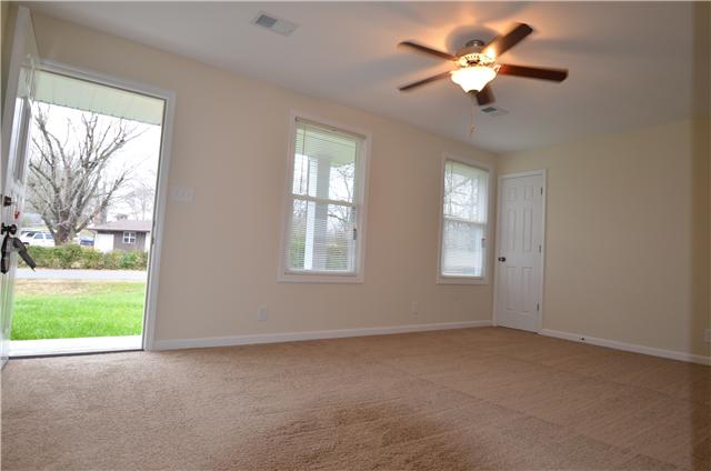121 Bluegrass Road Clarksville, TN 37042 - Photo 5 of 20 VIEW OF LARGE LIVING ROOM WITH ALL NEW PAINT, BEAUTIFUL NEW FREIZE CARPET, AND A LOVELY CEILING FAN.