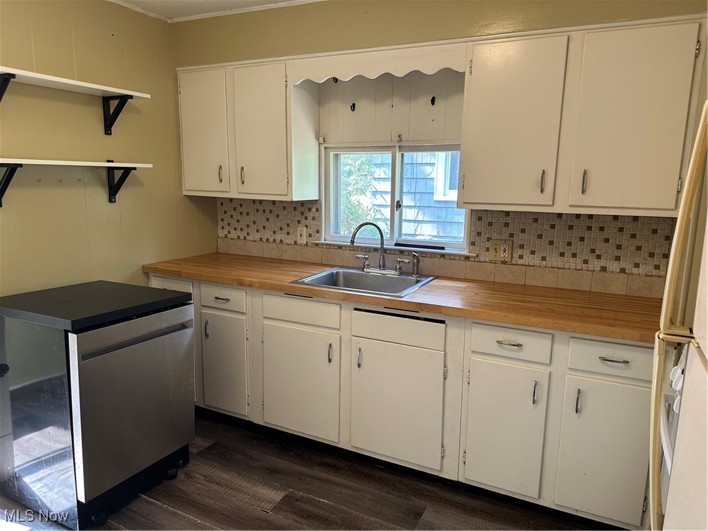 1596 Wood Road Cleveland Heights, OH 44121 - Photo 15 of 25 Kitchen with tasteful backsplash, dark wood-style flooring, open shelves, and white cabinetry