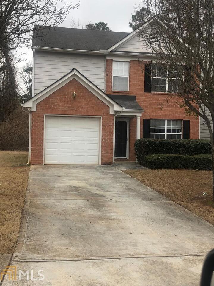 2317 Charleston Pointe Southeast Atlanta, GA 30316 - Photo 1 of 1 a front view of a house with garage