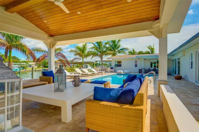 a view of a lake with tables and chairs