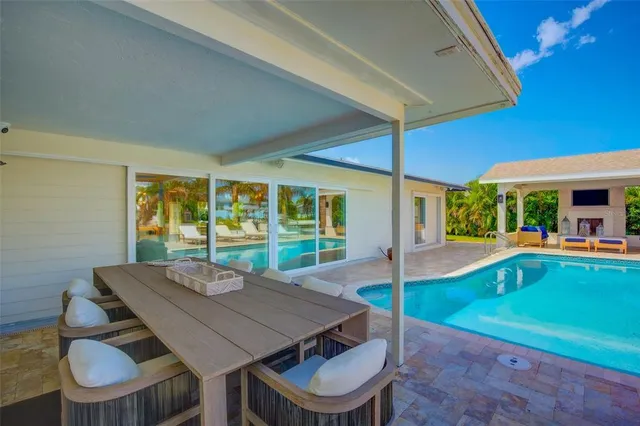 a bathroom with a shower a mirror and a sink