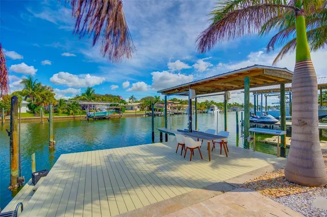 a bedroom with a bed couch and a window