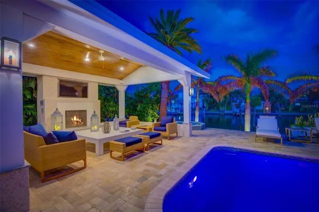 a view of a patio with table and chairs with wooden floor
