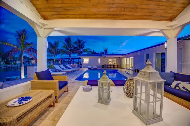 a view of a swimming pool with seating area