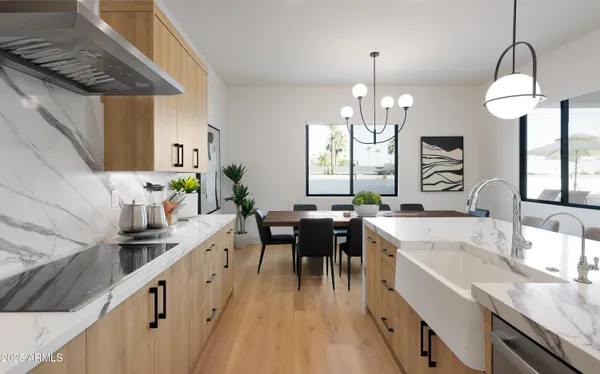 a kitchen with granite countertop a sink stove and cabinets