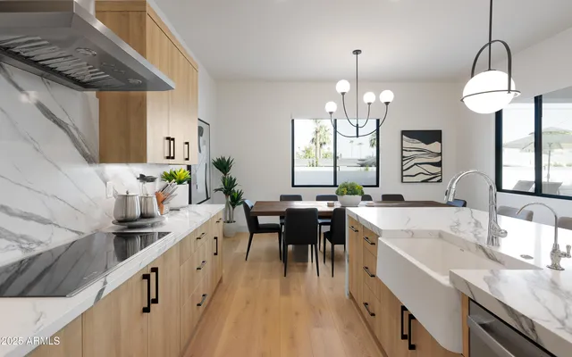 a kitchen with granite countertop a sink stove and cabinets