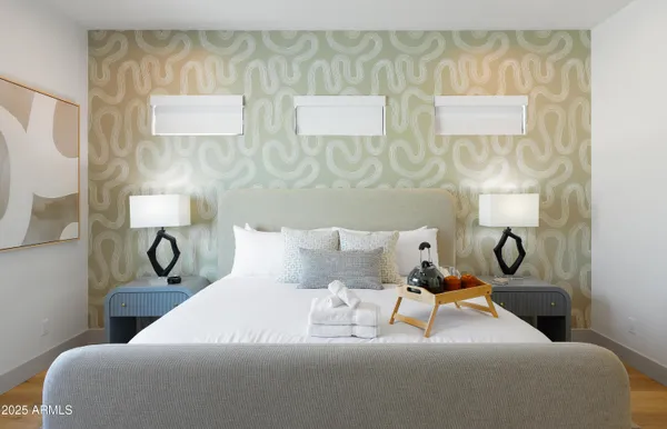 a bed room with a bed and wall painting