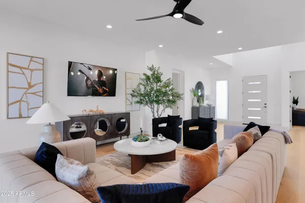 a living room with furniture and a flat screen tv