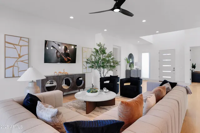 a living room with furniture and a flat screen tv