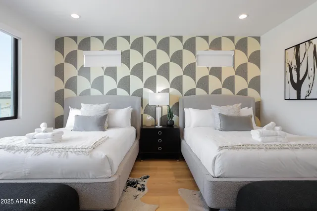 a bedroom with a bed and a lamp